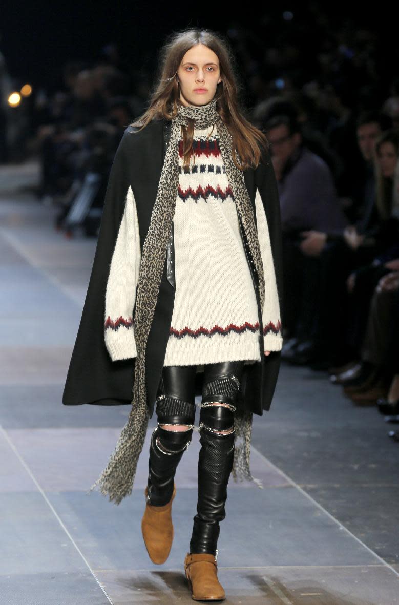 A model wears a creation by Born French fashion designer Hedi Slimane for St Laurent as part of the Men's fall-winter 2013-2014 fashion collection presented in Paris, Sunday , Jan. 20 2013 (AP Photo/ Jacques Brinon)