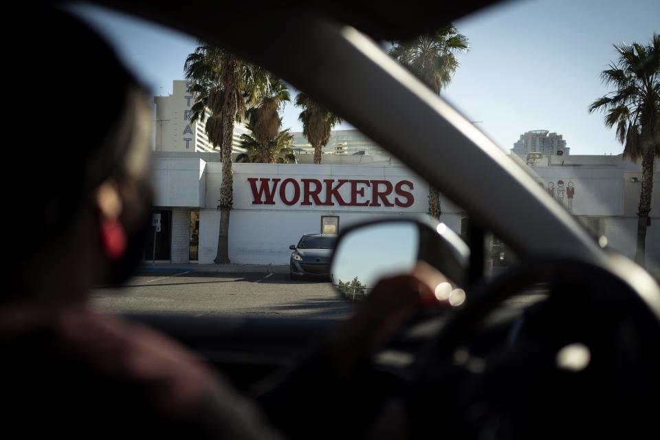 The office of the Culinary Workers Union is seen through a car window in Las Vegas, Monday, Nov. 9, 2020. The union represents 60,000 people, most of them immigrants, in the Las Vegas area who work in the hospitality industry. More than half of the members represented by the union are currently out of work due to the coronavirus pandemic. (AP Photo/Wong Maye-E)