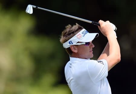 Ian Poulter plays a shot on the 11th hole during the final round of The Players Championship at TPC Sawgrass - Stadium Course. Mandatory Credit: Jake Roth-USA TODAY Sports