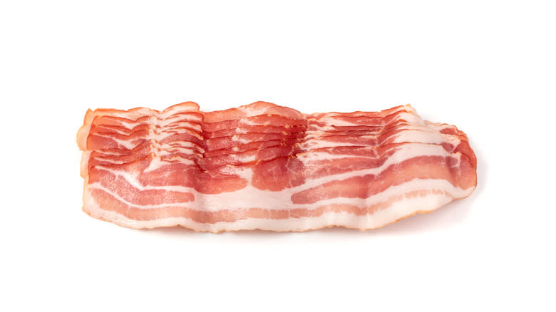 Bacon rashers on white background