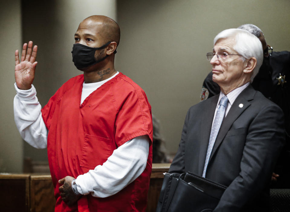 Hernandez Govan, left, the third suspect arrested in the murder of Memphis rapper Young Dolph, along with his lawyer William Massey, right, is arraigned in Judge Lee Coffee's courtroom on Thursday, Nov. 17, 2022. (Mark Weber/Daily Memphian via AP)