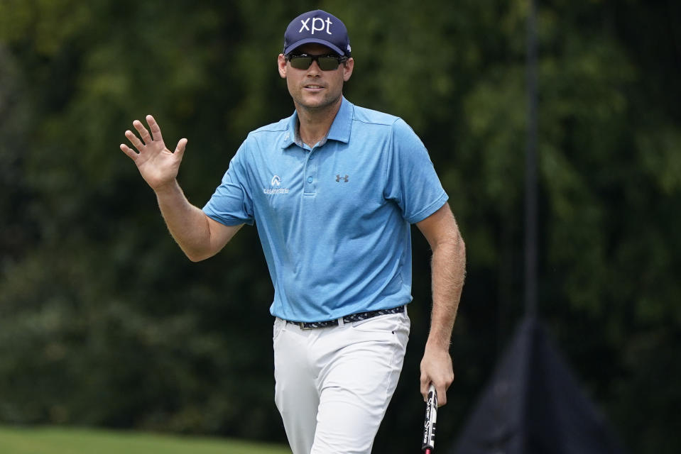 Adam Schenk waves after a birdie putt on ther first green during the third round of the Tour Championship golf tournament, Sunday, Aug. 27, 2023, in Atlanta. (AP Photo/Mike Stewart)