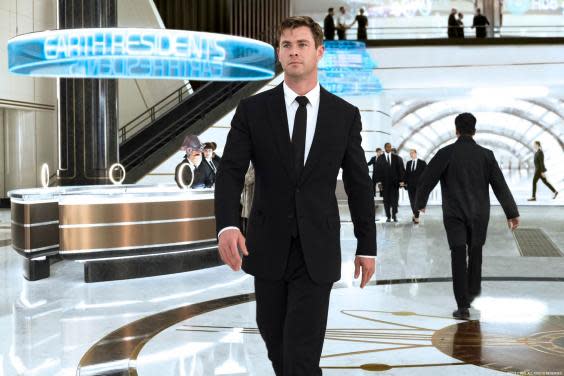 Chris Hemsworth as Agent H walking through the Men in Black's London headquarters (Sony)