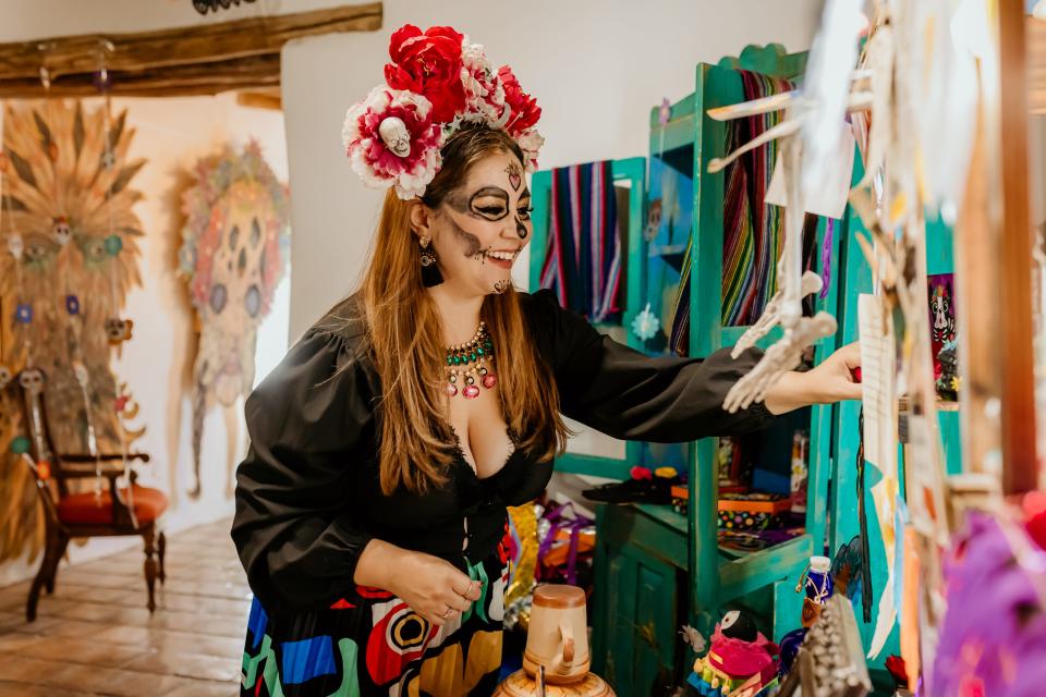 Darlene Jane Arvizu adjusts the altar at the dearly departed Casa Ortiz art gallery in Socorro that she created for the Día de los Muertos event, Amor Eterno, on Oct. 23, 2021. Casa Ortiz is now a ghostly memory, but Arvizu will show her altar skills at Jane & Jensen Nostalgia Shop on Sunday.