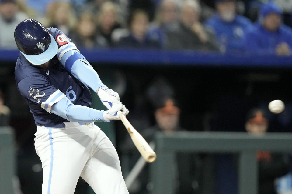 Kansas City Royals' Hunter Renfroe hits a two-run double during the sixth inning of a baseball game against the Baltimore Orioles Friday, April 19, 2024, in Kansas City, Mo. (AP Photo/Charlie Riedel)