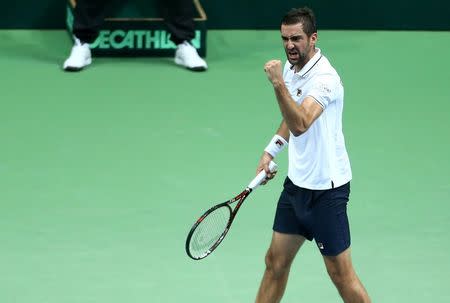 Tennis - Croatia v France - Davis Cup Semi Final - Kresimir Cosic Hall, Zadar, Croatia - 18/9/16 Croatia's Marin Cilic reacts during his singles match against France's Richard Gasquet. REUTERS/Antonio Bronic