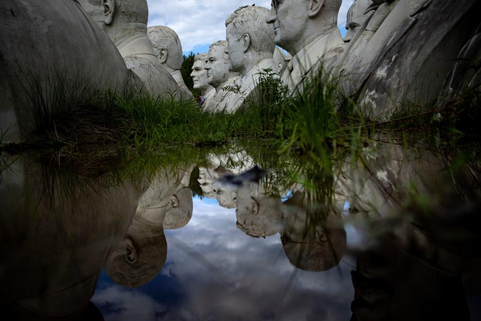 Salvaged busts of former US Presidents can be seen at a mulching business where they now reside August 25, 2019, in Williamsburg, Virginia. (Photo: Brendan Smialowski/AFP/Getty Images)