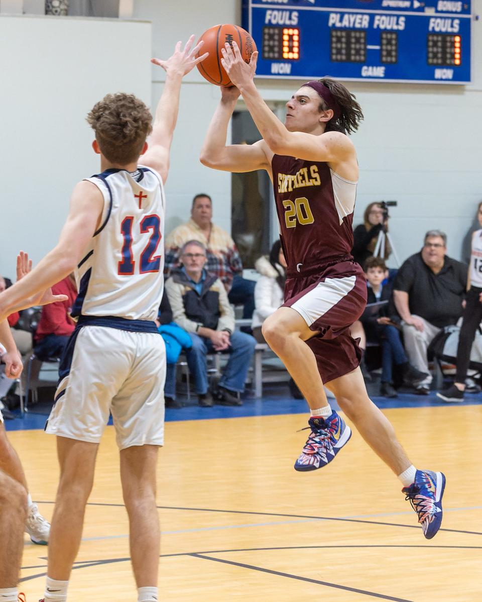 Charyl Stockwell's Christian Hammond puts up a running jumper while defended by Brandon Zimbelman during a 59-52 overtime victory at Livingston Christian on Tuesday, Feb 1, 2022.