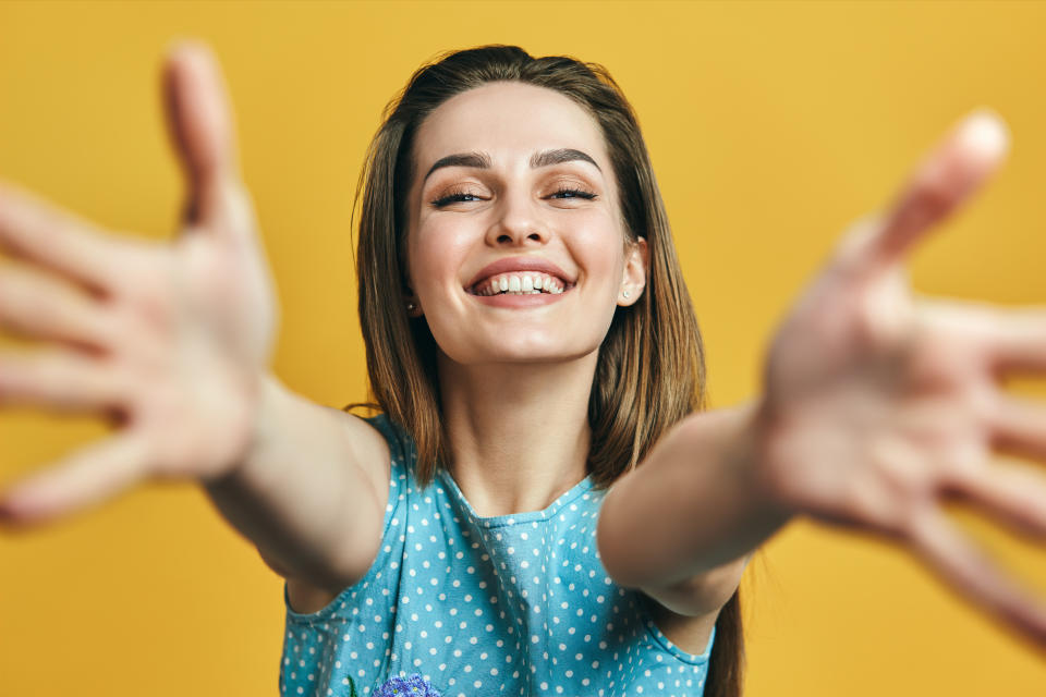 Etiquette experts say it's OK to politely decline a hug over COVID-19 concerns. (Photo: Getty Images stock)