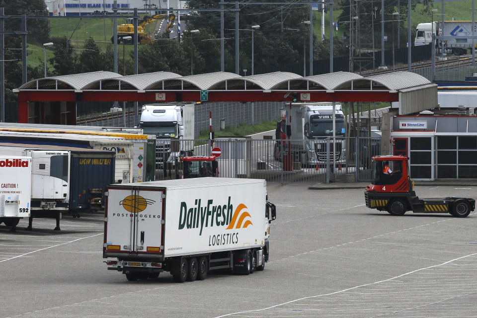 Trucks wait to make their way onto a ferry in Hook of Holland terminal in the harbor of Rotterdam, Netherlands, Tuesday, Sept. 11, 2018. Gert Mulder of the Dutch Fresh Produce Center that supports some 350 traders and growers associations fears the worst if negotiators trying to hammer out a Brexit deal fail. One truck driver showing up at the docks without the proper paperwork "could throw it all into chaos," he says. (AP Photo/Peter Dejong)