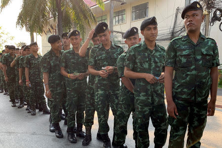 Soldiers line up for their early vote for the upcoming Thai election at a polling station in Pattani province, Thailand, March 17, 2018. REUTERS/Panu Wongcha-um