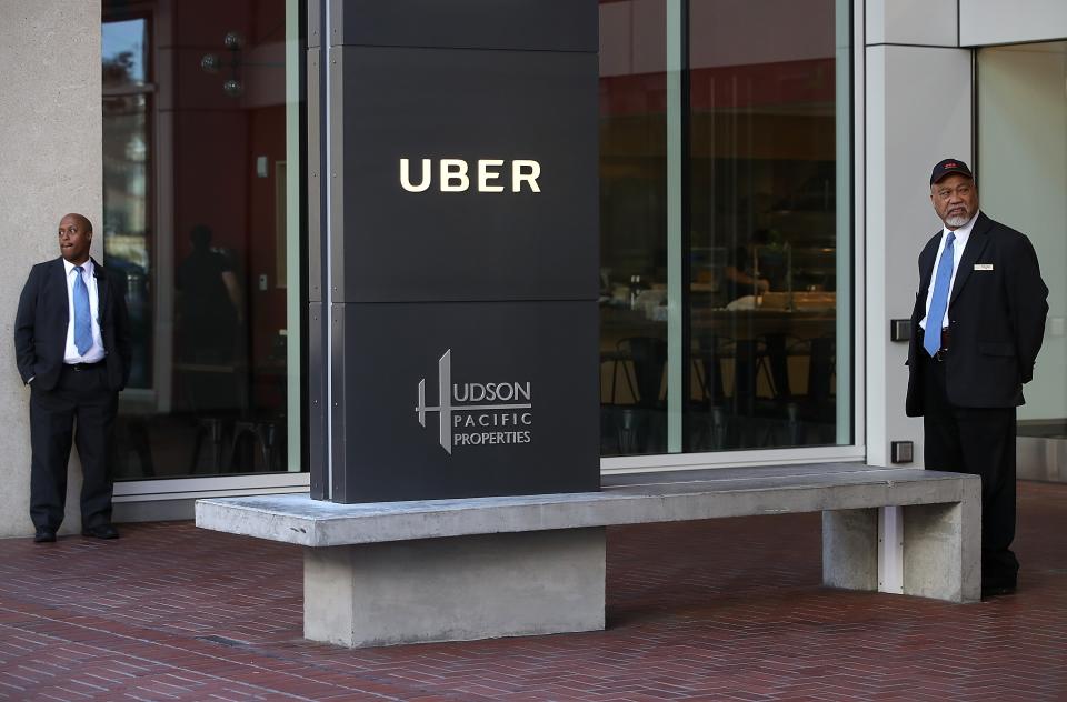 Private security guards stand in front of Uber headquarters on June 13, 2017 in San Francisco, California. (Justin Sullivan/Getty Images)