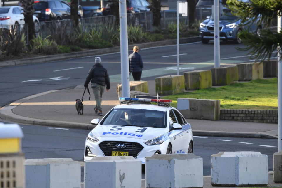 A police car patrols along Bondi Beach in Sydney, Australia. 