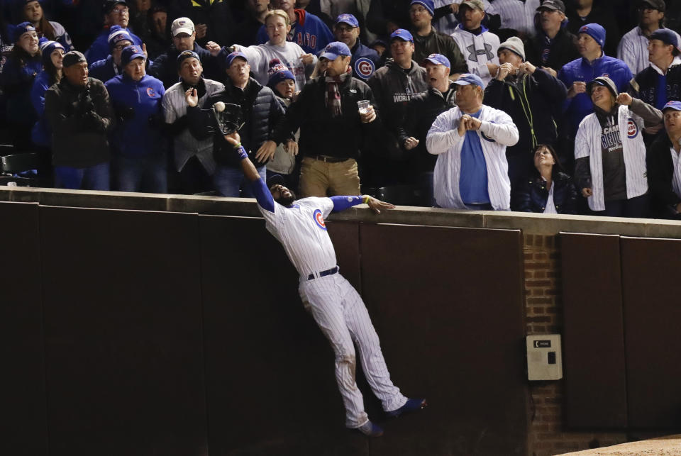 FILE - Chicago Cubs right fielder Jason Heyward catches a fly ball hit by Cleveland Indians' Trevor Bauer during the third inning of Game 5 of the Major League Baseball World Series Sunday, Oct. 30, 2016, in Chicago. Five-time Gold Glove outfielder Jason Heyward plans to play baseball next season, even if won’t be with the Cubs. Heyward hasn't been in a game since June 24 because of right knee inflammation. Cubs President of Baseball Operations Jed Hoyer said last month that Heyward won't be with Chicago next year. (AP Photo/Charles Rex Arbogast, File)