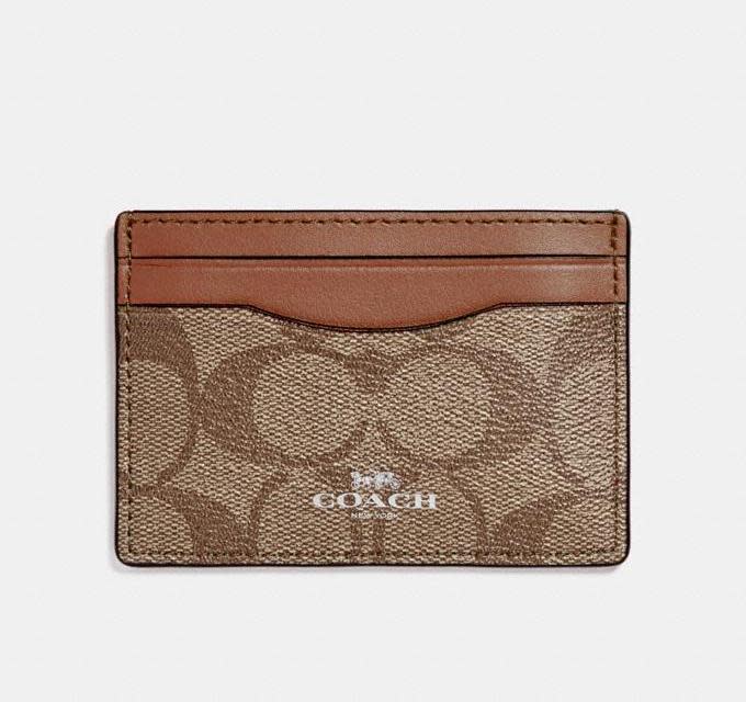 Card Case In Signature Canvas. Image via Coach OUtlet.