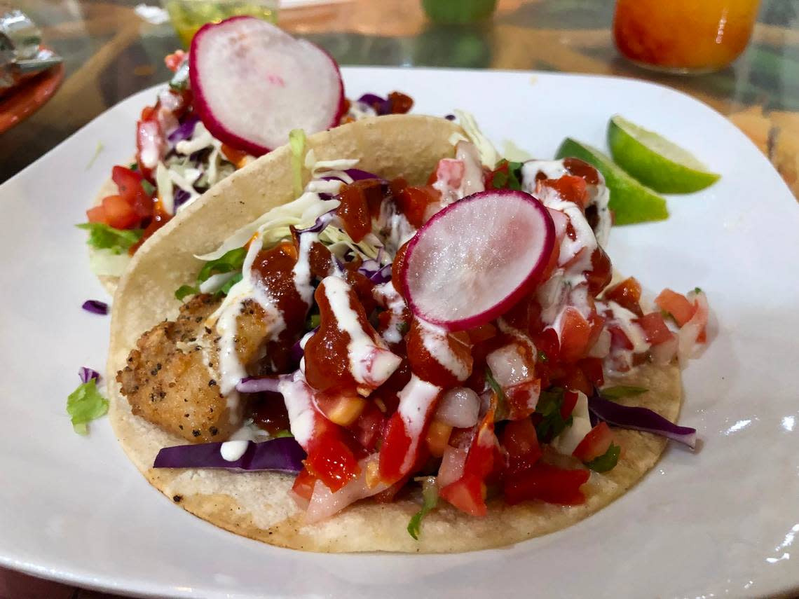 El Papagayo’s crispy cod tacos are fully loaded with slaw, crema and a house “diabla sauce.”