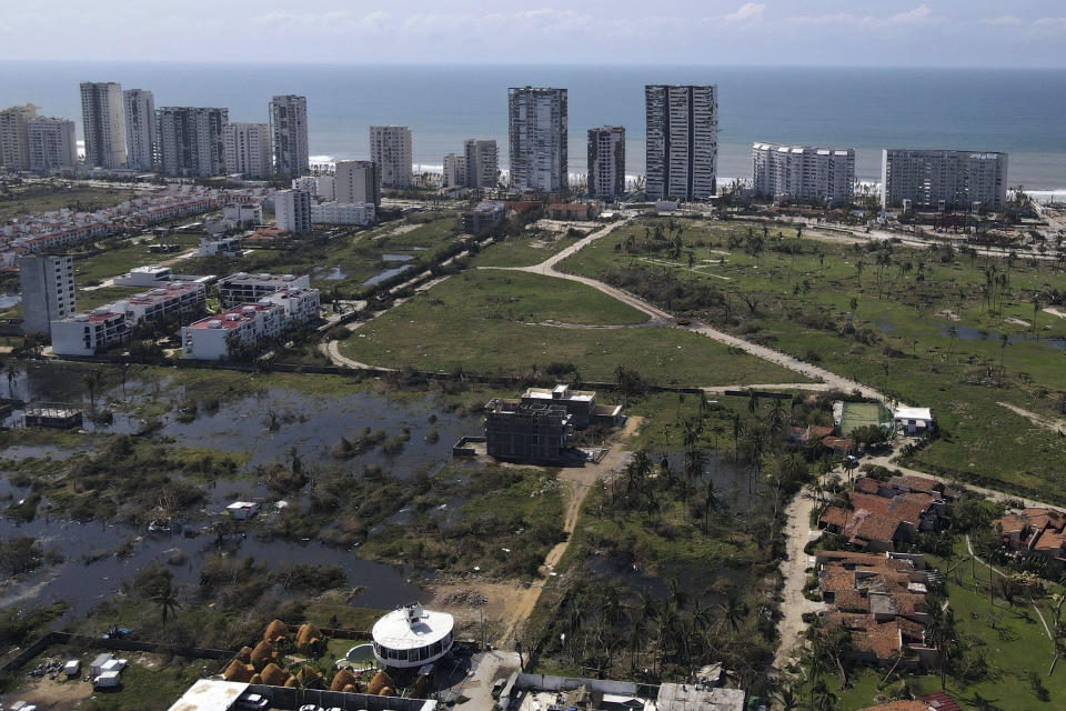 FILE - Hotels affected by Hurricane Otis stand battered two days after the passage a storm in Acapulco, Mexico, Oct. 27, 2023. October was the fifth straight month that Earth set a record for the hottest month in recorded history. (AP Photo/Marco Ugarte, File)