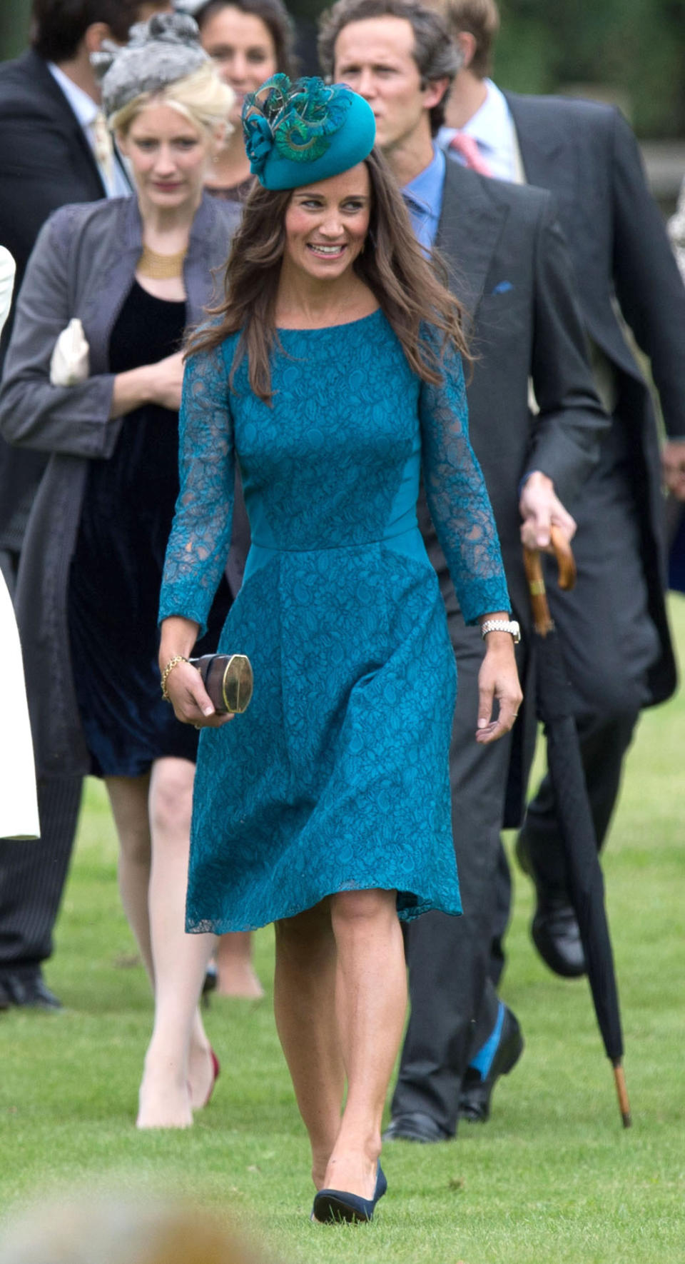 <p>For James Meade’s wedding to Lady Laura Marsham at St. Nicholas Church in Gayton, Pippa wore a teal midi dress with a matching hat. <em>[Photo: PA]</em> </p>