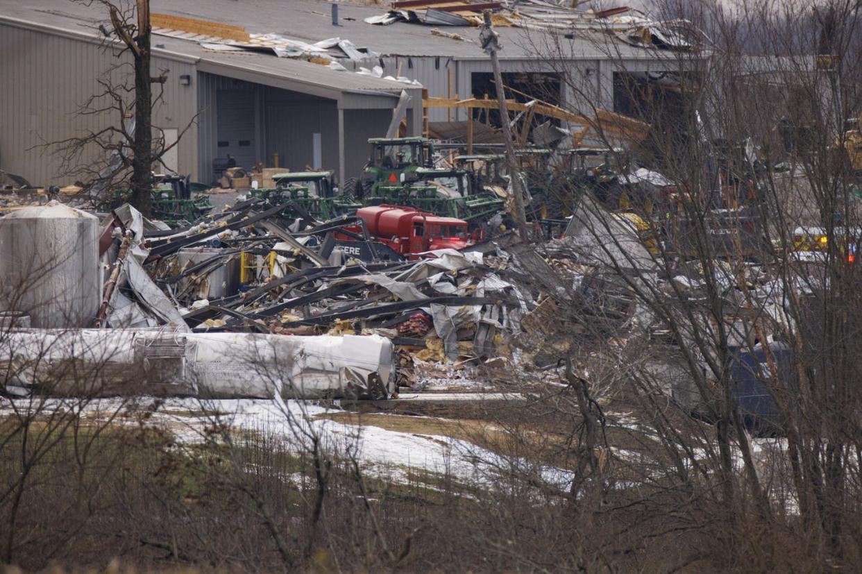 <span class="caption">A collapsed building in Mayfield, Ky., after a tornado hit the town on Dec. 11, 2021.</span> <span class="attribution"><a class="link " href="https://www.gettyimages.com/detail/news-photo/general-view-of-the-collapsed-mayfield-consumer-products-news-photo/1237162507" rel="nofollow noopener" target="_blank" data-ylk="slk:Brett Carlsen/Getty Images;elm:context_link;itc:0;sec:content-canvas">Brett Carlsen/Getty Images</a></span>