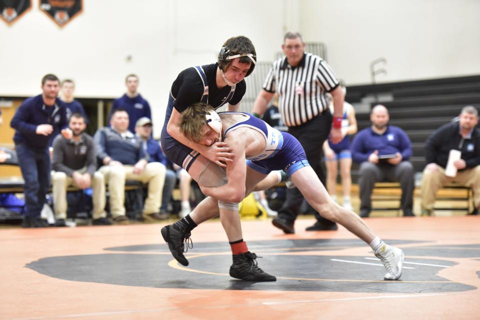 Richmond's Jacob Fink (right) wrestles Yale's Logan Winters during a match last season.