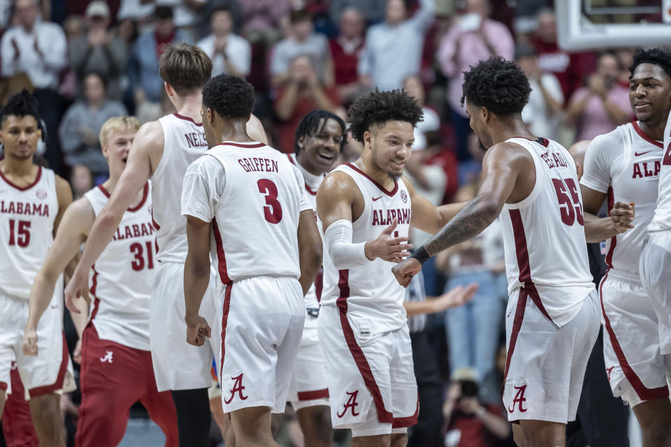 Alabama guards Mark Sears (1) and Aaron Estrada (55) celebrate as Alabama takes a lead over Florida during overtime in an NCAA college basketball game Wednesday, Feb. 21, 2024, in Tuscaloosa, Ala. (AP Photo/Vasha Hunt)