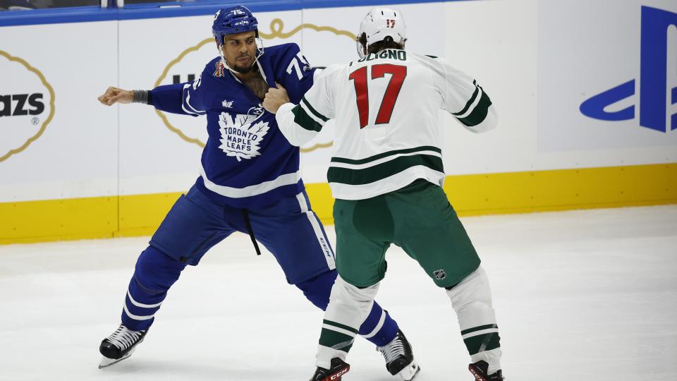 TORONTO. Toronto Maple Leafs Ryan Reaves ( l) fights Marco Folingo of the Minnesota Wild in a hard hitting first period. NHL action.(R.J.Johnston/Toronto Star) (Photo R.J. Johnston Toronto Star/Toronto Star via Getty Images)