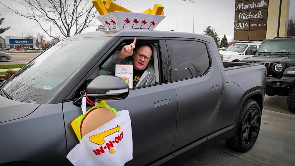 In-N-Out fan Keith Smith, Boise, adorned his pickup with his kids’ Halloween costumes. He had just turned the corner and could see the menu order sign at the California-based chain’s Idaho debut Tuesday in Meridian.