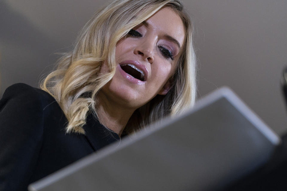 White House press secretary Kayleigh McEnany reads from her notes as she speaks during a news conference at the Republican National Committee, Monday, Nov. 9, 2020, in Washington. (AP Photo/Alex Brandon)