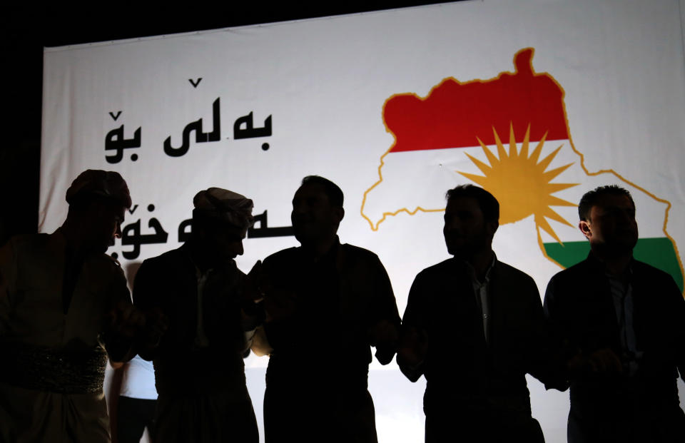 <p>Iraqi Kurdish people take part in a gathering on Sept. 20, 2017, to urge people to vote in the upcoming independence referendum in Arbil, the capital of the autonomous Kurdish region of northern Iraq. (Photo: Safin Hamed/AFP/Getty Images) </p>