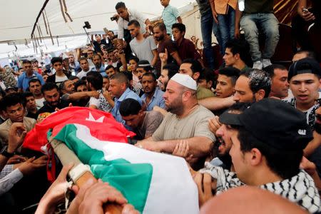 People attend the funeral of Mohammad Jawawdah in Amman, Jordan July 25, 2017. REUTERS/Muhammad Hamed.