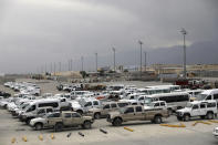 FILE - In this July 5, 2021 file photo, vehicles are parked at Bagram Airfield after the American military left the base, in Parwan province north of Kabul, Afghanistan. The US and NATO have promised to pay $4 billion a year until 2024 to finance Afghanistan’s military and security forces, which are struggling to contain an advancing Taliban. Already since 2001, the U.S. has spent nearly $89 billion to build, equip and train the forces, including nearly $10 billion for vehicles and aircraft. (AP Photo/Rahmat Gul, File)