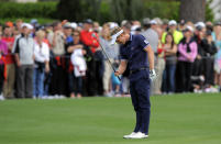 Luke Donald, of England, reacts after missing a putt for birdie on the 18th green during the final round of the RBC Heritage golf tournament in Hilton Head Island, S.C., Sunday, April 20, 2014. Matt Kuchar won the tournament with 11-under par. (AP Photo/Stephen B. Morton)
