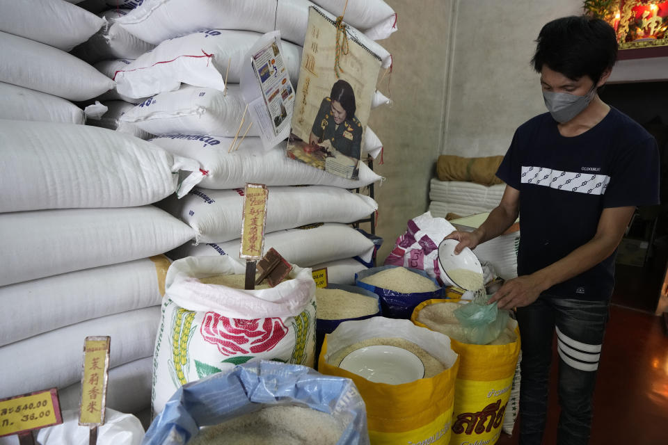 A worker prepare rice for sale in in Bangkok, Thailand, on Thursday, Aug. 10, 2023. Countries worldwide are scrambling to secure rice after a partial ban on exports by India cut supplies by roughly a fifth. The lack of clarity about what India will do next and concerns about the El Nino means Thai exporters are reluctant to take orders, mill operators are unwilling to sell and farmers have increased the prices of unmilled rice, said the president of the Thai Rice Exporters Association. (AP Photo/Sakchai Lalit)