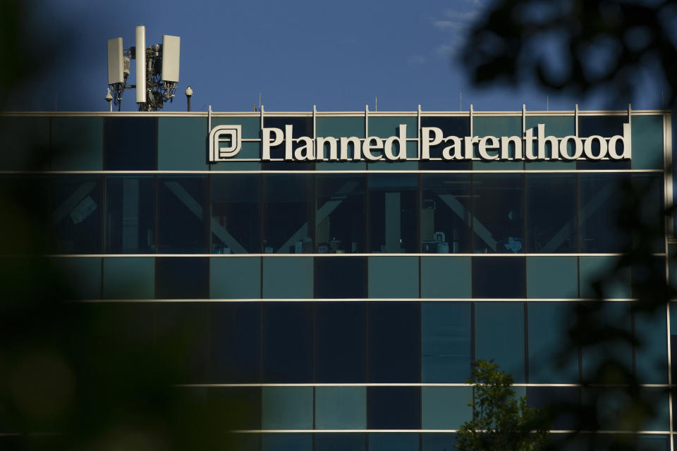 FILE - This April 19, 2019, file photo shows a Planned Parenthood building in Houston. A network of eight Christian pregnancy centers in Texas will provide contraceptive options next year as it vies for federal funding Planned Parenthood relinquished earlier this summer. The Source will take the unprecedented step of offering women pills, injections, and intrauterine devices while the organization looks to build an additional 20 clinics across Texas. The Source Chief Executive Andy Schoonover says the organization is focused on being proactive in reducing unplanned pregnancies.(Godofredo A Vasquez/Houston Chronicle via AP, File)