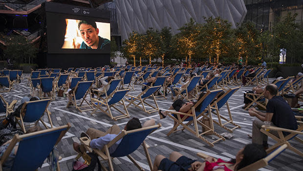 Moviegoers take in an outdoor screening of 