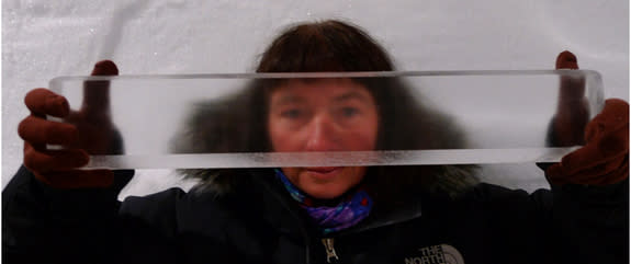 Researcher Dorthe Dahl-Jensen of the University of Copenhagen holds a piece of Greenland ice core.