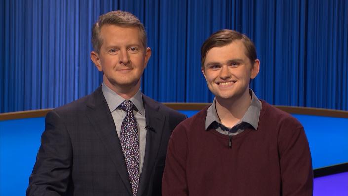 "Jeopardy!" host Ken Jennings, left, stands on the TV quiz-show's set with contestant Jake DeArruda of Ludlow.