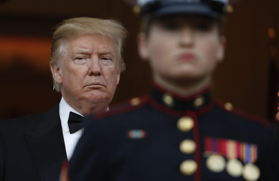 US President Donald Trump waits for the arrival Britain's Prince Charles and Camilla, Duchess of Cornwall with the first lady Melania Trump outside Winfield House in London, Tuesday, June 4, 2019. Trump is on a State visit to Britain. (AP Photo/Alastair Grant)