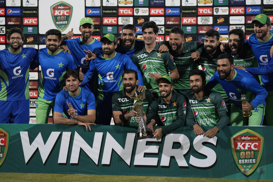 Pakistani players pose for photo with the trophy after won the series against New Zealand by 4-1 during a presentation ceremony on the end of fifty one-day international match between Pakistan and New Zealand, in Karachi, Pakistan, Sunday, May 7, 2023. (AP Photo/Fareed Khan)