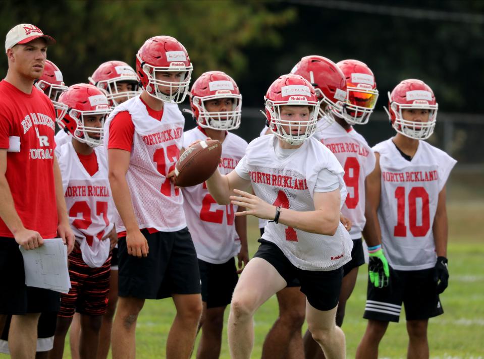 Quarterback Tyler Italiano (4) with the North Rockland High School football team, work out on the opening day of practice, Aug. 20, 2022, at their school in Thiells. 