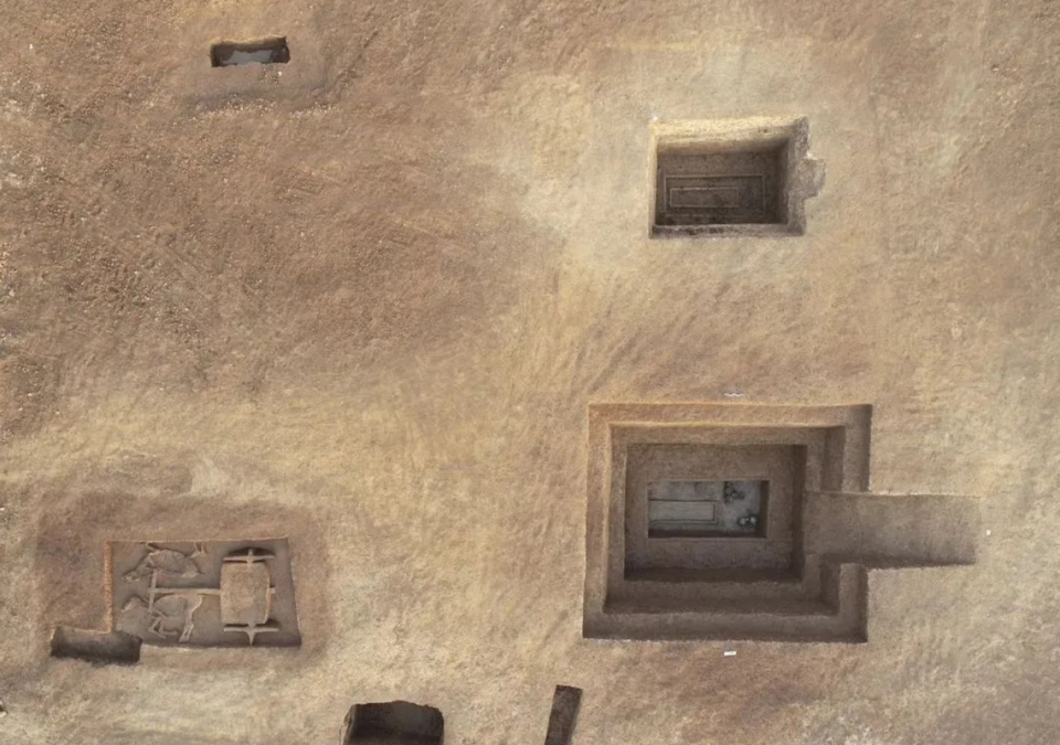 Some of the excavated tombs, including one on the bottom left with a carriage and horses