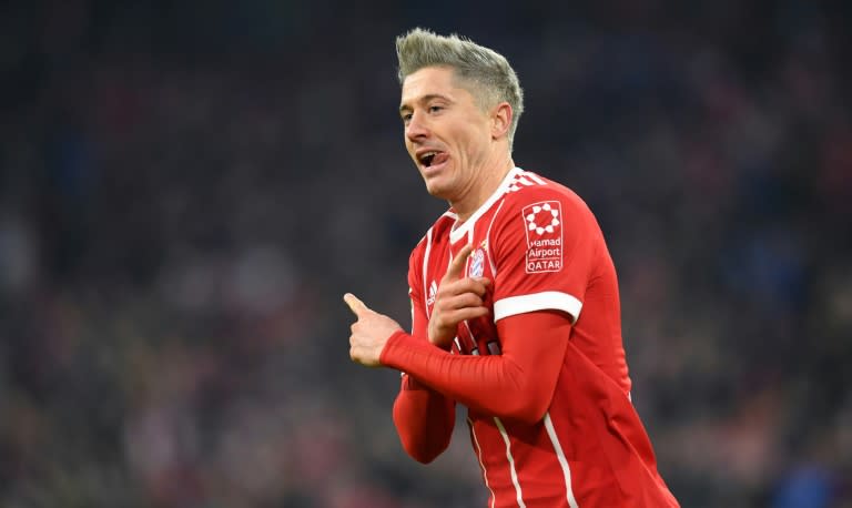 Bayern Munich's forward Robert Lewandowski celebrates after scoring against Augsburg in Munich, southern Germany, on November 18, 2017