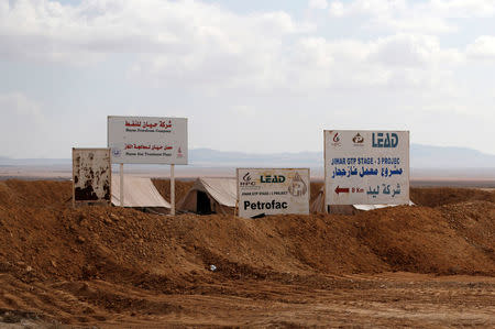 Signs are seen at the Hayan gas factory and treatment plant in Homs province, Syria, March 4, 2017. REUTERS/Omar Sanadiki