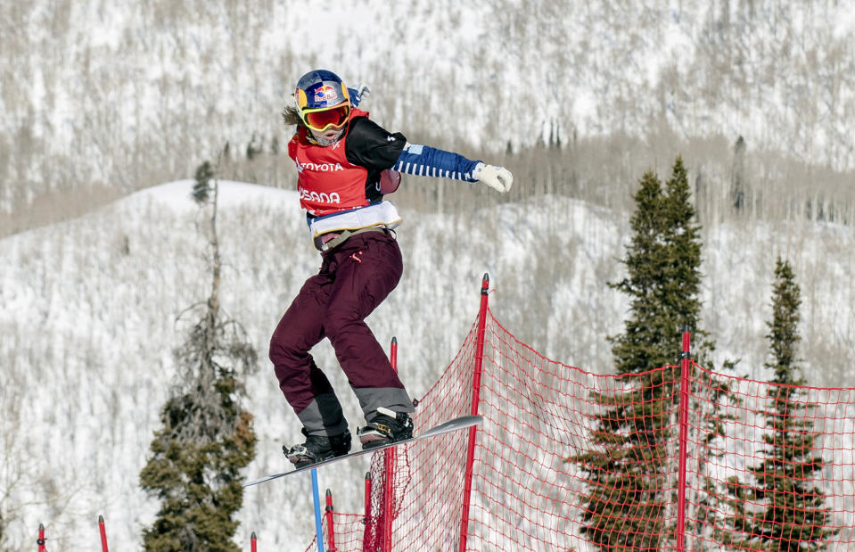 Eva Samkova, of the Czech Republic, clears a jump in the women's Snowboard Cross final at the Freestyle Ski and Snowboard World Championships, Friday, Feb. 1, 2019, in Solitude, Utah. Samkova won the event. (AP Photo/Tyler Tate)