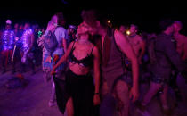 <p>A couple dances as approximately 70,000 people from all over the world gather for the 30th annual Burning Man arts and music festival in the Black Rock Desert of Nevada, Aug. 31, 2016. (REUTERS/Jim Urquhart)</p>