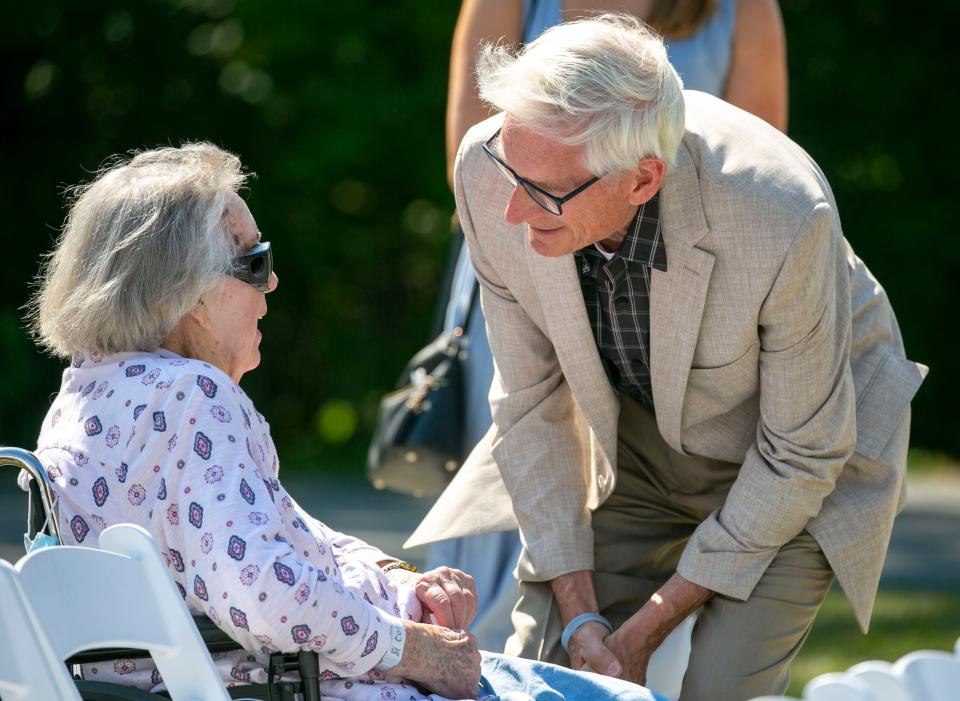 Rocky Knoll resident Resident Collette Flood speaks to Wisconsin Gov. Tony Evers following a special ceremony honoring Ever's father, Dr. Raymond Evers, Friday, September 9, 2022, in Plymouth, Wis.