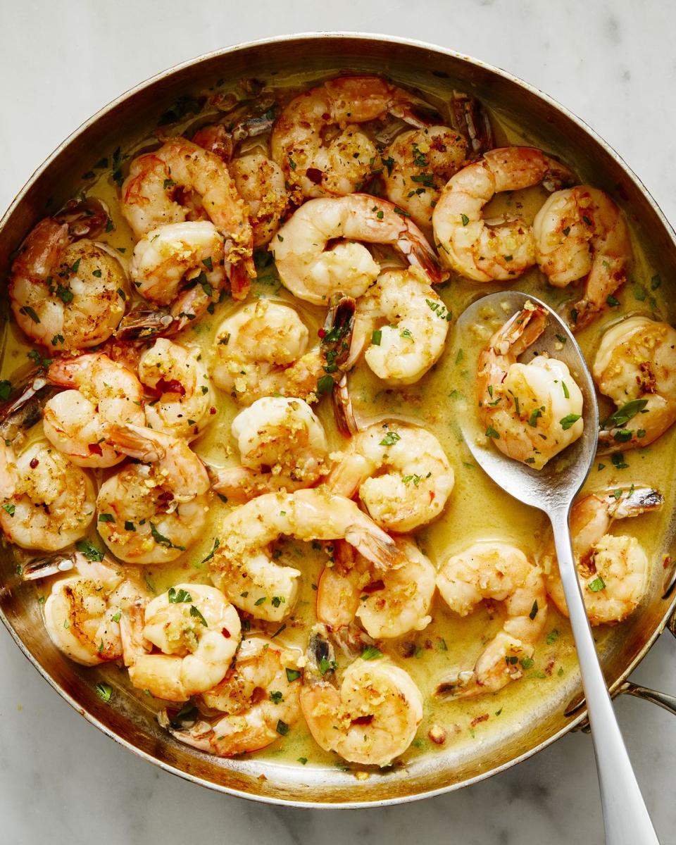 shrimp scampi topped with breadcrumbs, parsley, and red pepper flakes