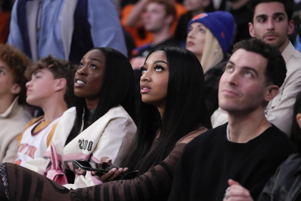 LSU basketball forward Angel Reese sits in a court side seat during the second half of an NBA basketball game between the New York Knicks and the Brooklyn Nets, Friday, April 12, 2024, at Madison Square Garden in New York. The Knicks won 111-107. (AP Photo/Mary Altaffer)