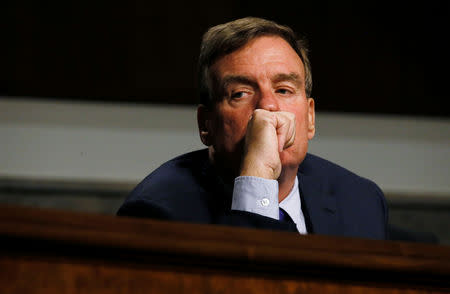 Senate Intelligence Committee Vice Chairman Senator Mark Warner listens to testimony from Twitter CEO Jack Dorsey and Facebook COO Sheryl Sandberg at a hearing on foreign influence operations on social media platforms on Capitol Hill in Washington, U.S., September 5, 2018. REUTERS/Jim Bourg/File Photo