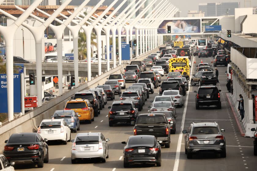 LOS ANGELES CA NOVEMBER 18, 2021 - Lines of cars work there way around the horseshoe at Los Angeles International Airport on Thursday, November 18, 2021. Up to 2 million people are expected to pass through LAX during the two-week Thanksgiving holiday period that begins today, potentially doubling the number from the same time last year. The busiest days are expected to be this Friday and the Sunday after Thanksgiving, November 28th. (Al Seib / Los Angeles Times)